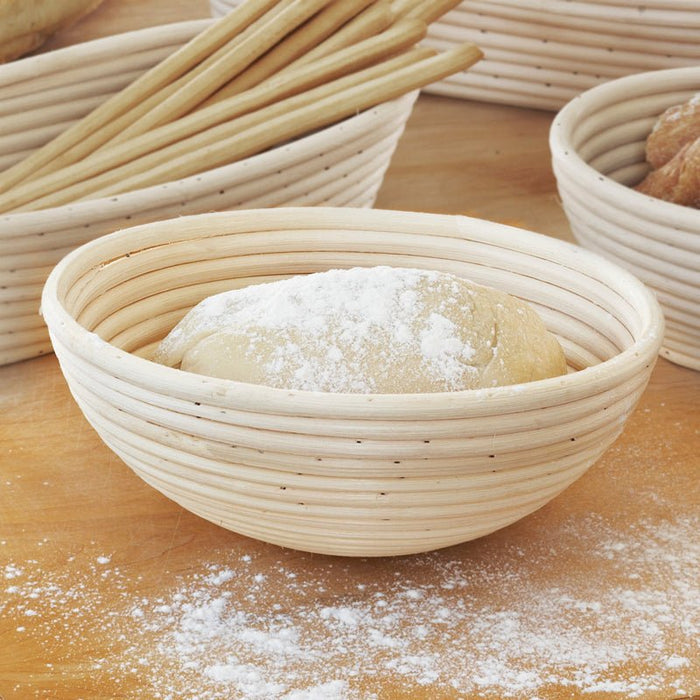 Port Style 10-inch round banneton basket for bread baking, made of natural rattan for shaping dough.