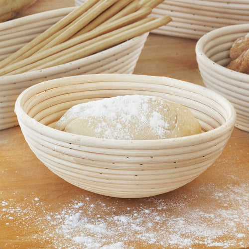 Port Style 10-inch round banneton basket for bread baking, made of natural rattan for shaping dough.