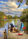 Cobble Hill jigsaw puzzle of Two dogs on a dock by a lake with a sailboat and trees in the background.