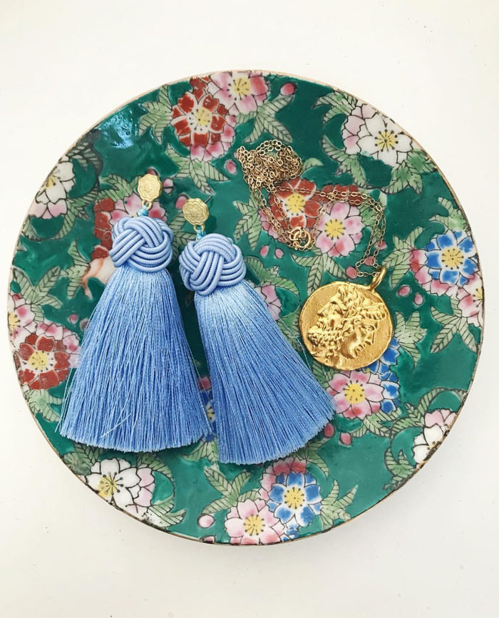 hart cornflower blue topknot tassel earrings in bowl
