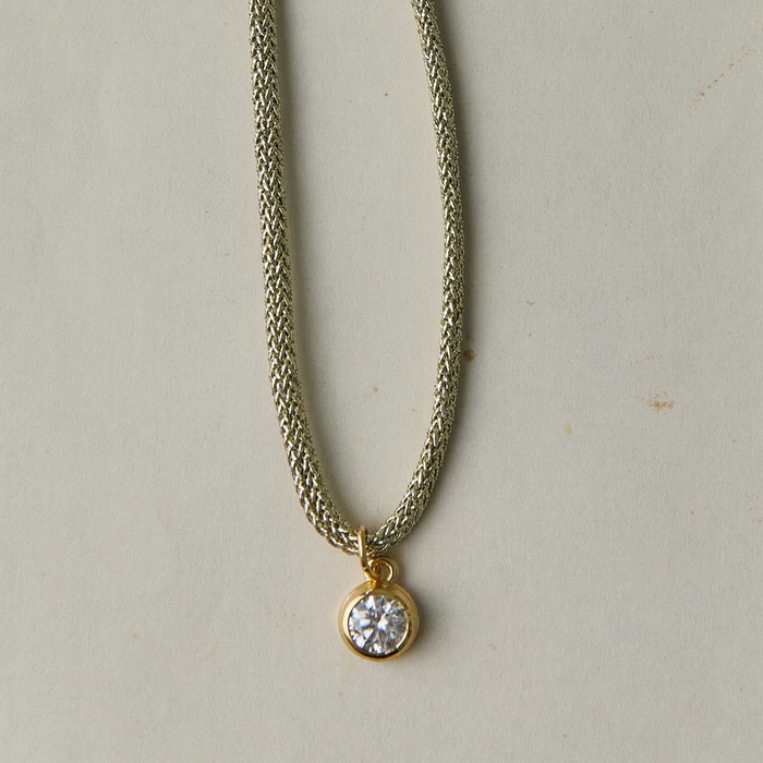 The Bezel Charm on Gold Lurex Cord