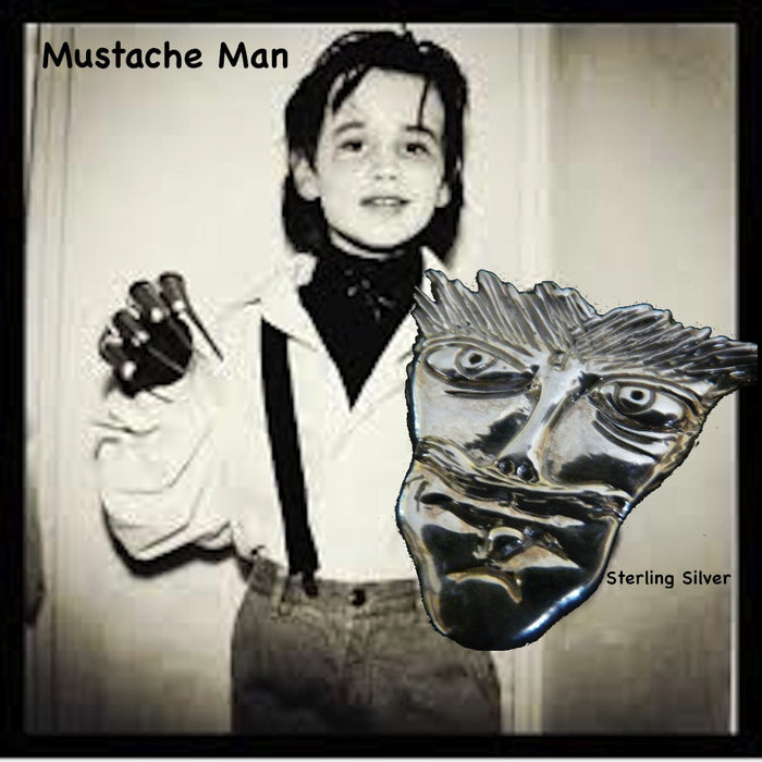 Picture of 8 year old Reeve Carney as an 8 year old Edward Scissorhands for Halloweeen. Another wonderful piece I  designed from a drawing one of my sons when he was only 8 years old. It has that little boy "feistiness" about it!  1--5/16" x 1-1/4" Hand Made in the USA. Hand signed.  Sterling Silver Mustache Man Face-in Pendant or Pin.
