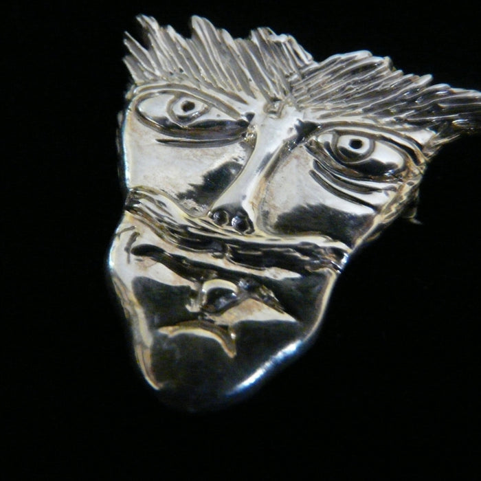 Based on some drawings actor, musician Reeve Carney made when he was 8 years old.Another wonderful piece I  designed from a drawing one of my sons when he was only 8 years old. It has that little boy "feistiness" about it!  1--5/16" x 1-1/4" Hand Made in the USA. Hand signed.  Sterling Silver Mustache Man Face-in Pendant or Pin.