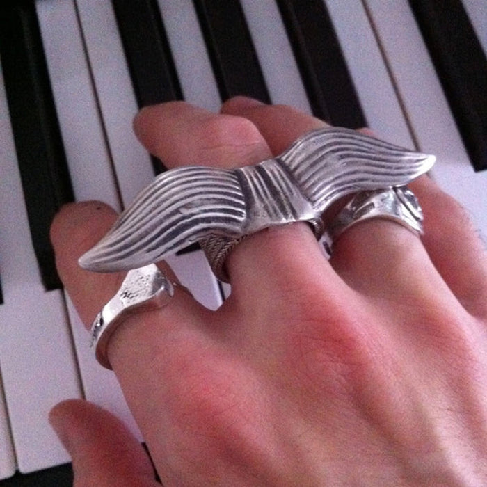 "Close detail view of the Not Your Father's Mustache Ring in oxidized sterling silver — 3-inch wide handmade statement ring by Fables in the Air"