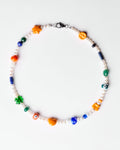 pearl necklace with orange and green charms