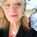 The PERSONAL AUTONOMY KEY is Sterling Silver with hand enameled Hot Pink and Red around the bottom. Approximately &nbsp; 2" x 2". Handmade, hand-enameled and hand-signed Sterling Silver Large Clock-Winding Key. If you are the keeper of the door, then this is a MUST to add to your collection of wearable KEYS! Sterling Silver PERSONAL AUTONOMY KEY Charm comes with a Sterling Silver chain like the one shown here. Comes in branded cotton pouch and gift boxed.