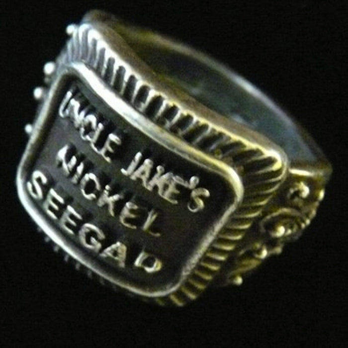 Even if you are not a cigar aficionado, this vintage cigar band ring is "smoking". The first in what will be an expansive and whimsical collection,  this 3D version of an actual antique "Seegar" band--the first of its kind. Sterling Silver in my antique satin oxidized finish to bring the old cigar band to life once again!  Top 1/2" wide approximately.  Made in the USA by hand. Hand signed.  Sterling Silver Uncle Jake's Nickel Seegar Cigar Band Ring.  Be sure to check out my other two cigar band rings--Mild
